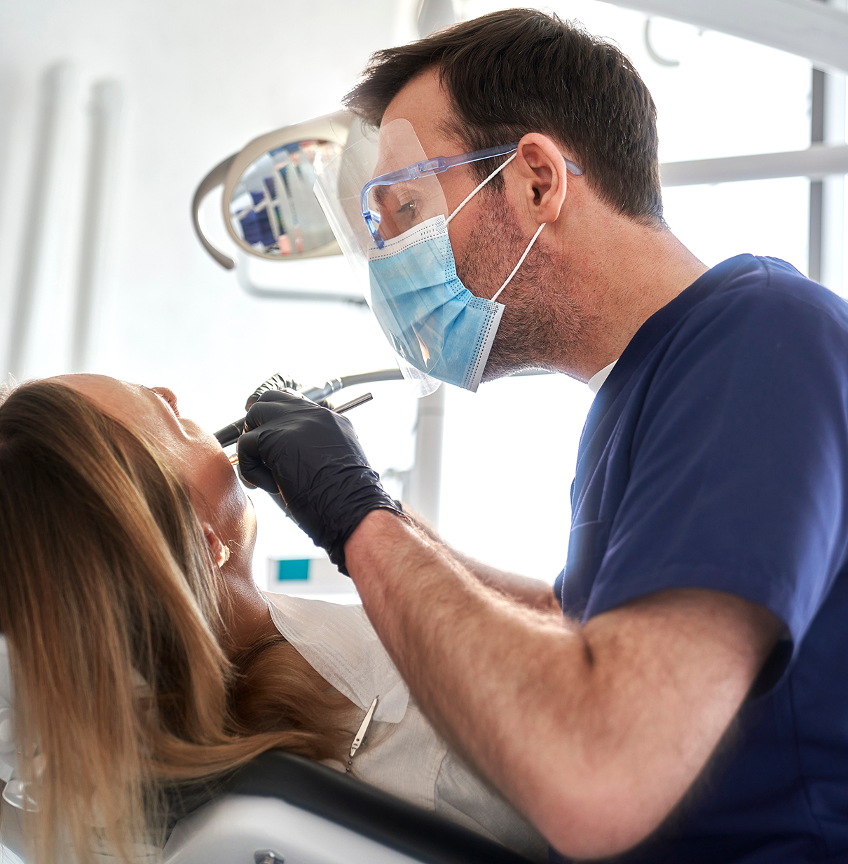 Dental professional working on patient