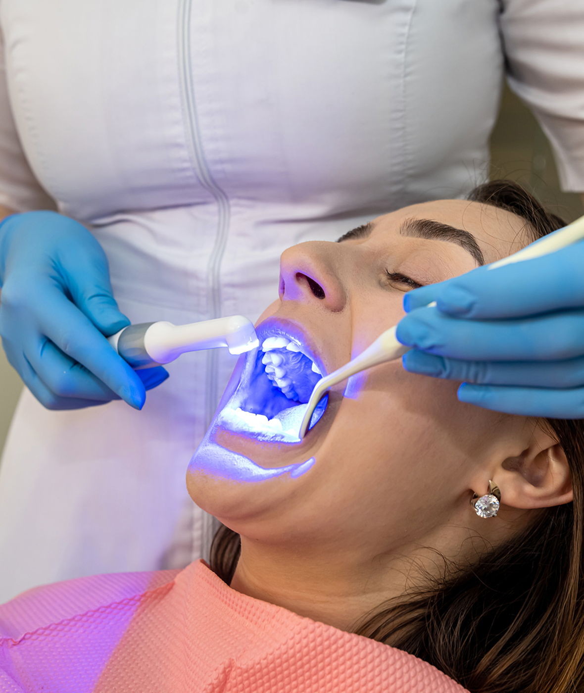 Patient receiving dental treatment with tools