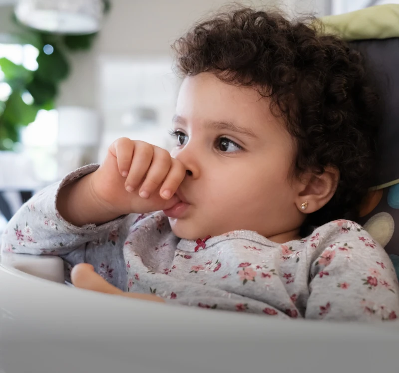 Toddler with curly hair relaxing